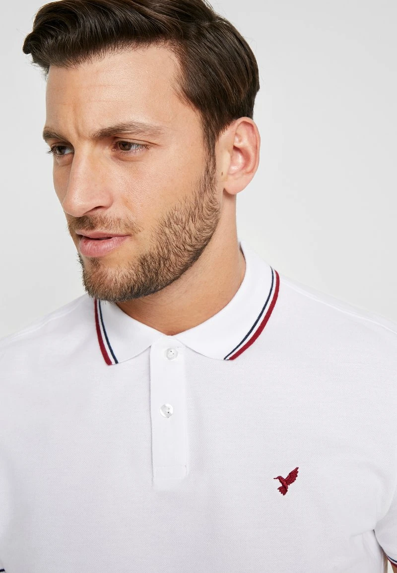 Poloshirt - white Pier One Poloshirt - White -Bekleidungsgeschäft 0580ae6b87ed4c03aa70cbcb6d676a42